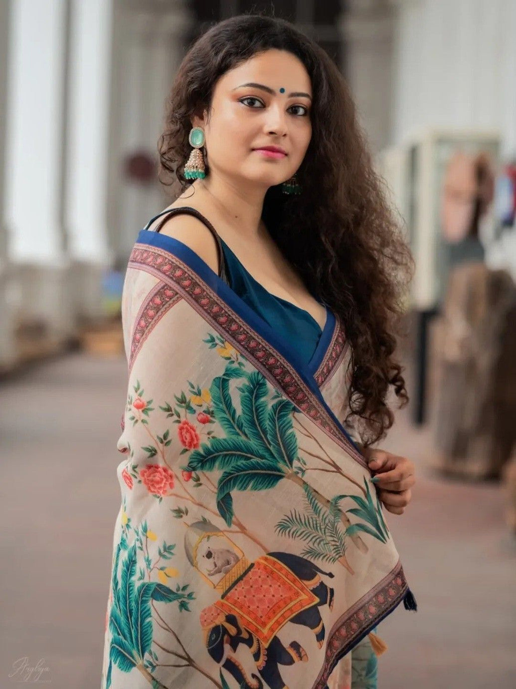 Cream Floral Printed Saree with Traditional Elephant Motifs
