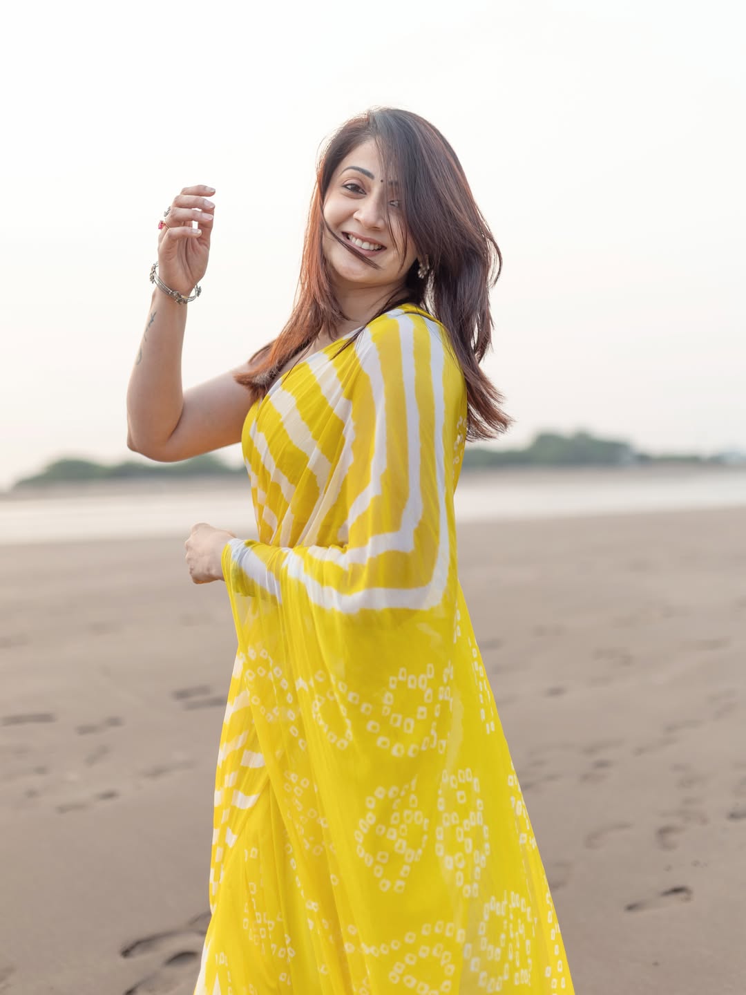 Radiant Yellow Chevron Leheriya Saree with Tassels