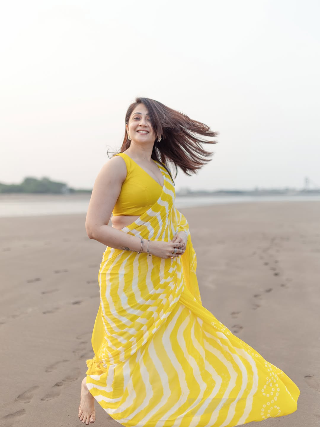 Radiant Yellow Chevron Leheriya Saree with Tassels