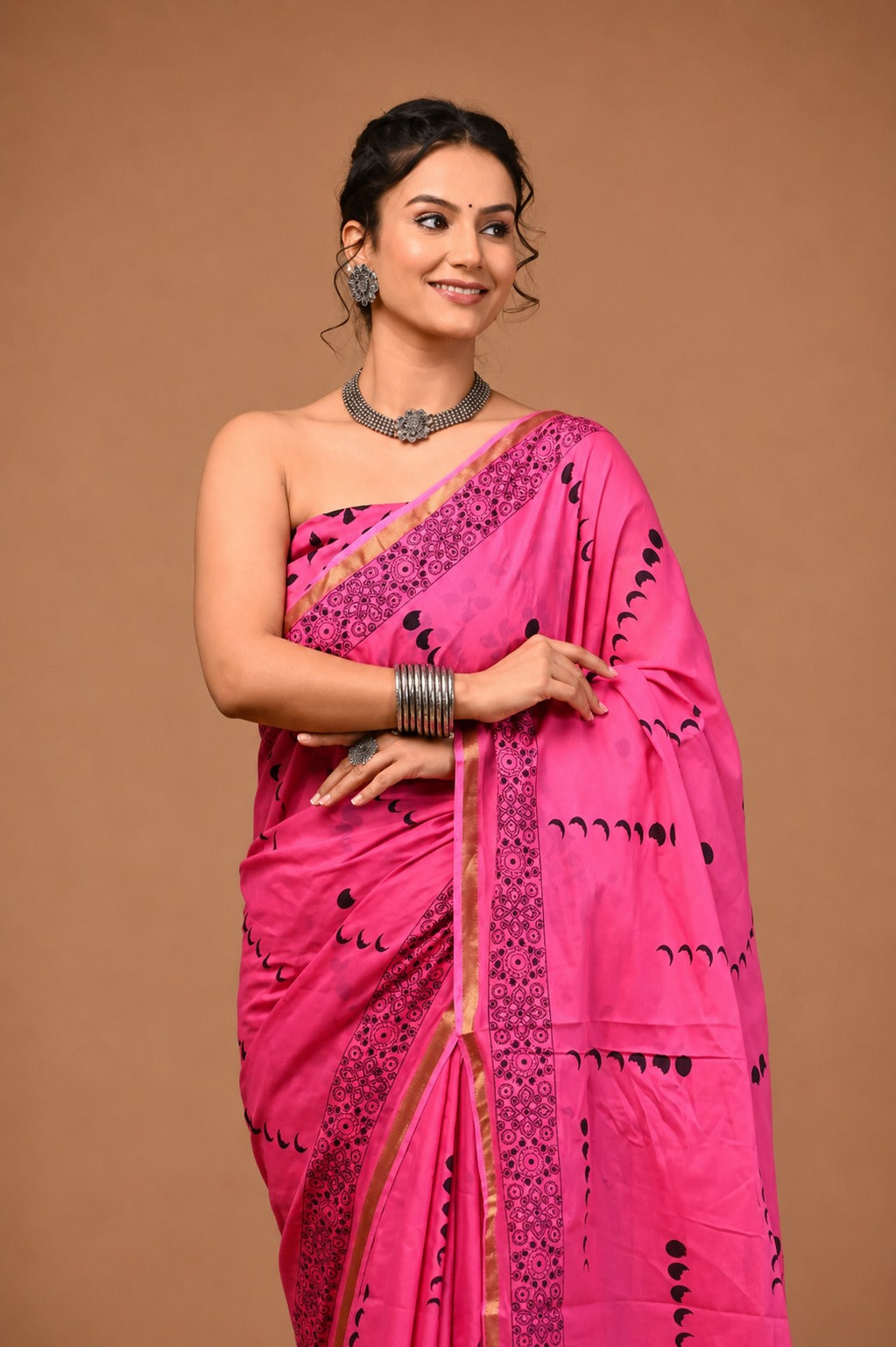 Vibrant Pink Crescent-Motif Saree with Intricate Border